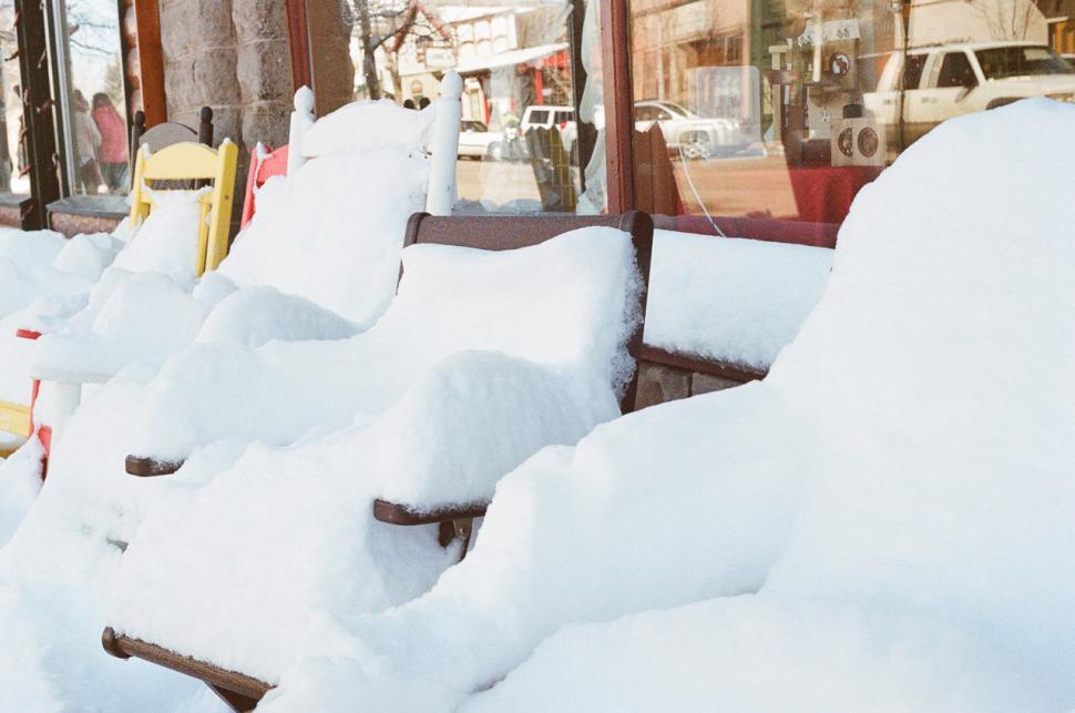 Free Image of Row of Park Benches Covered in Snow 