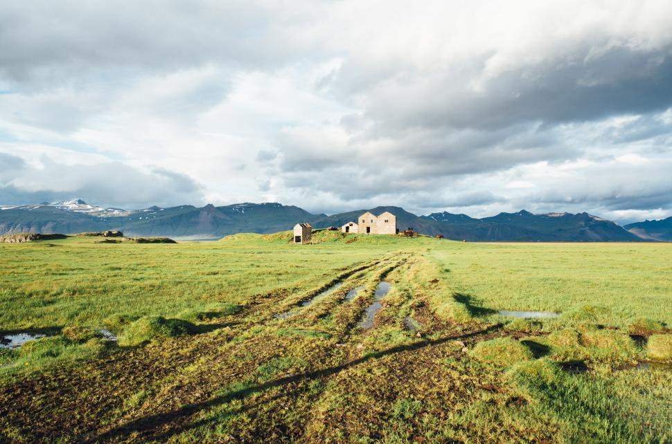 Free Image of House and Mountains in Grass Field 