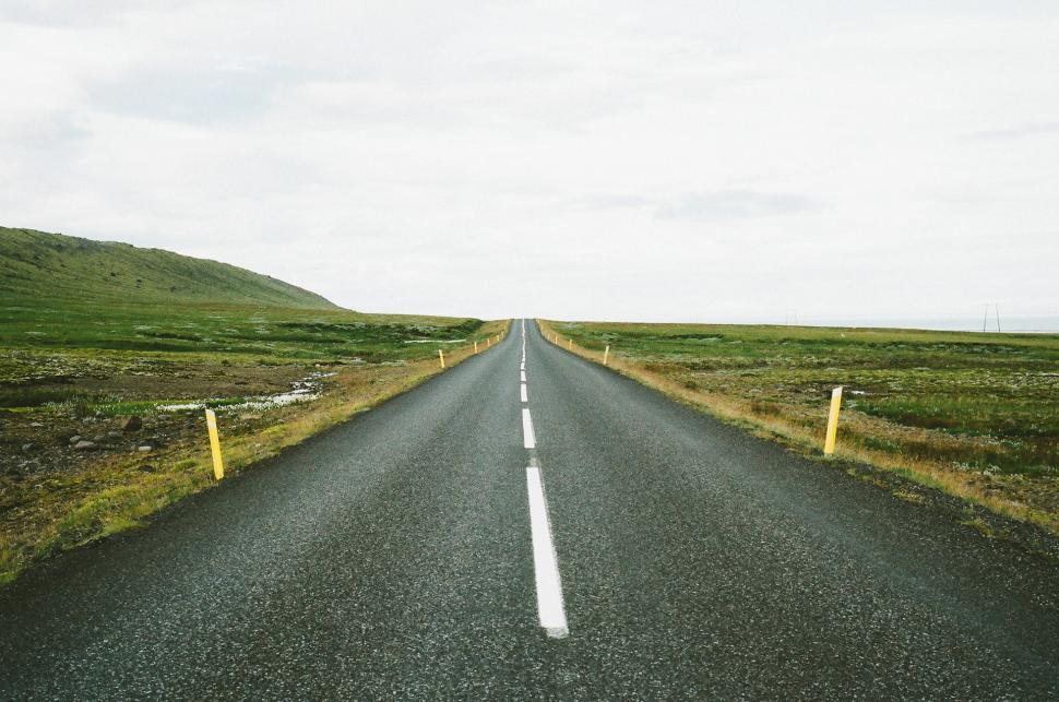Free Image of Barren Road Stretching Across Desolate Landscape 