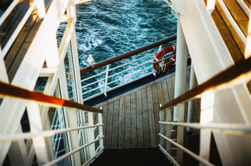 Free Image of Stairway Leading to Boat in Ocean 