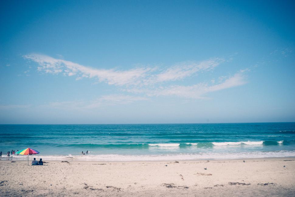 Free Image of Sandy Beach With Blue Sky and Ocean 