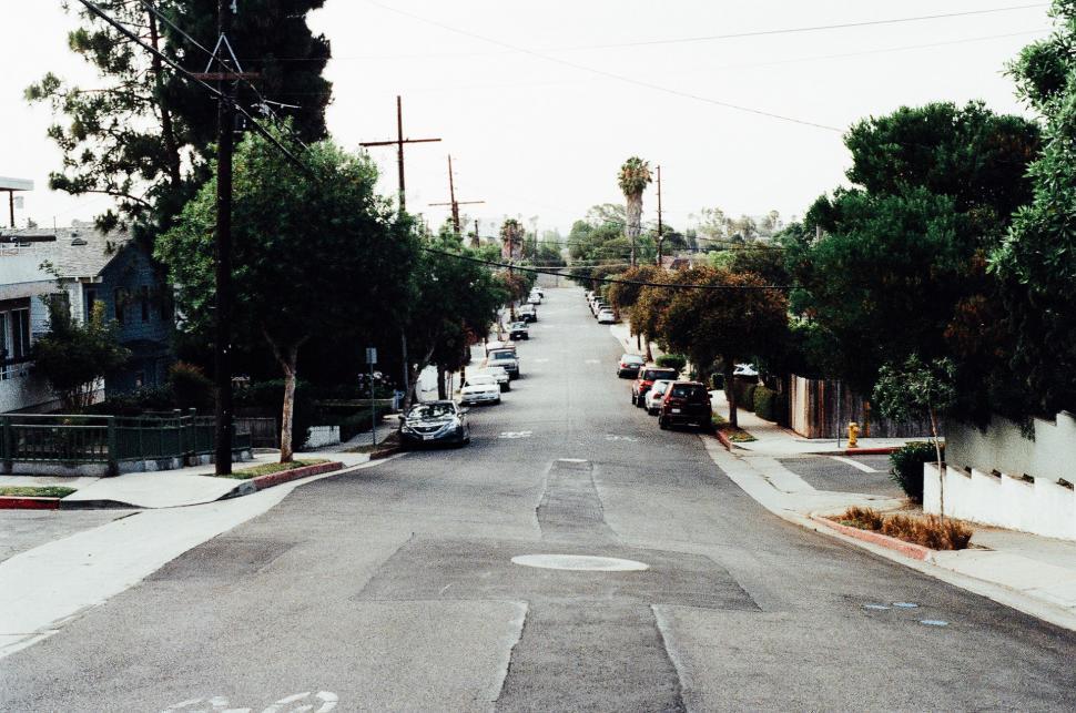 Free Image of Empty Street With Parked Car 