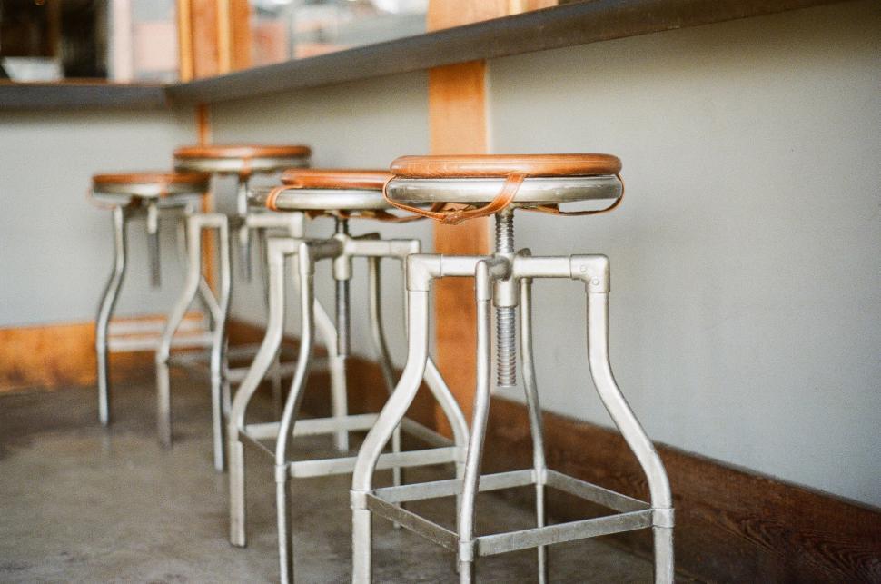 Free Image of Row of Stools Situated Side by Side 