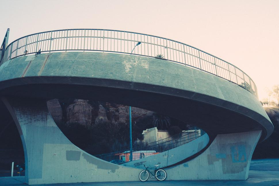 Free Image of Skateboarder Riding Under Bridge 