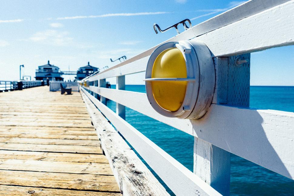 Free Image of Wooden Pier With Yellow Button 