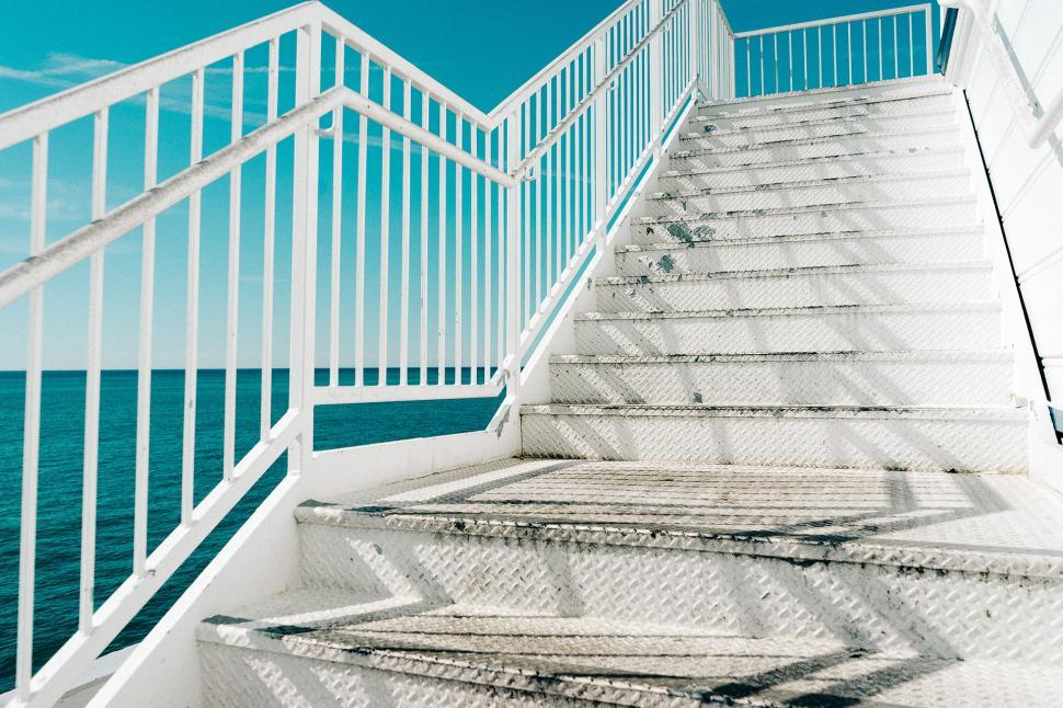 Free Image of White Staircase Leading Up to the Ocean 