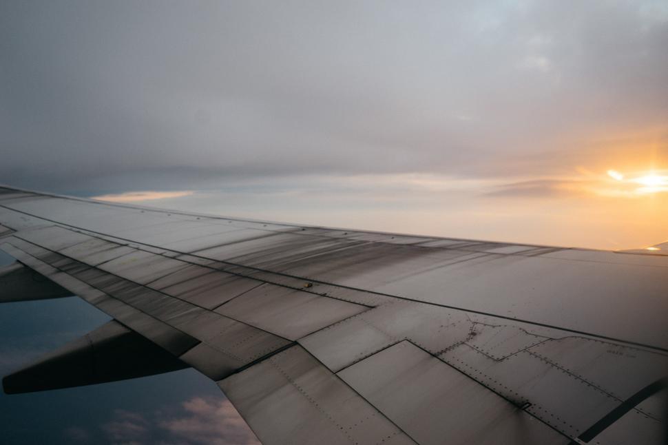 Free Image of Wing of an Airplane at Sunset 