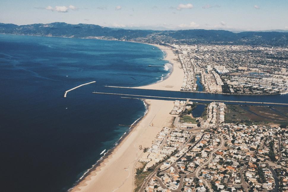 Free Image of Aerial View of a Beach and City 