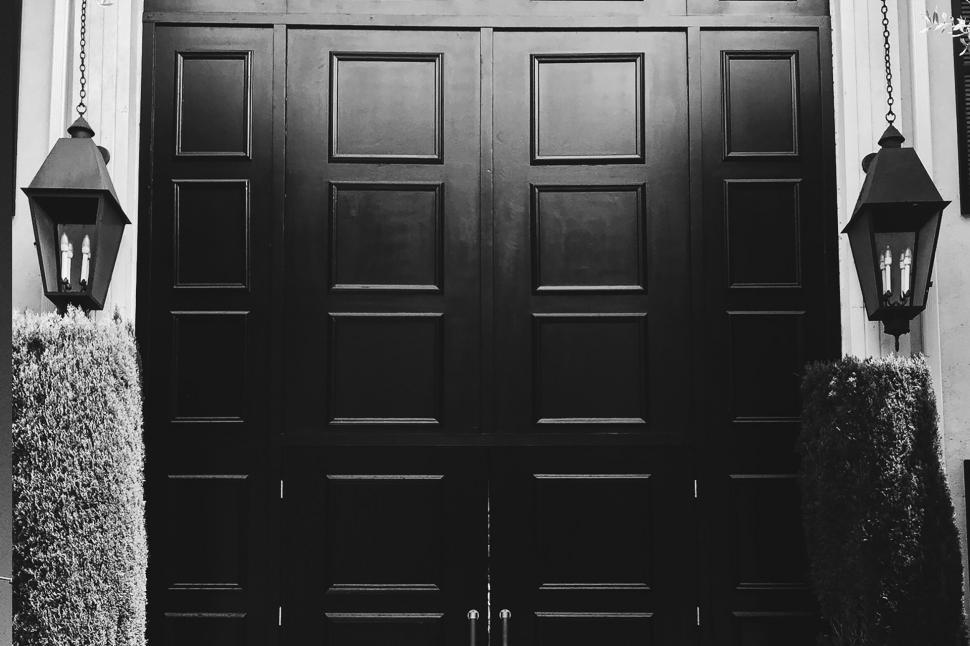 Free Image of A Black and White Photo of a Front Door 