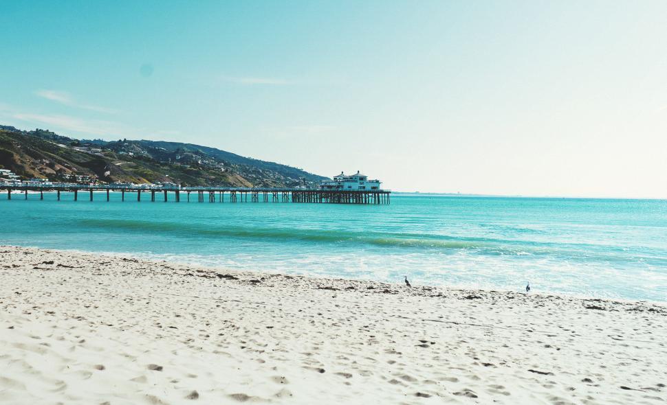 Free Image of Pier and Body of Water at the Beach 