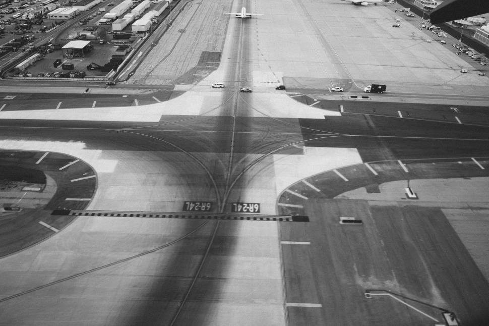Free Image of Black and White Photo of an Airport Runway 