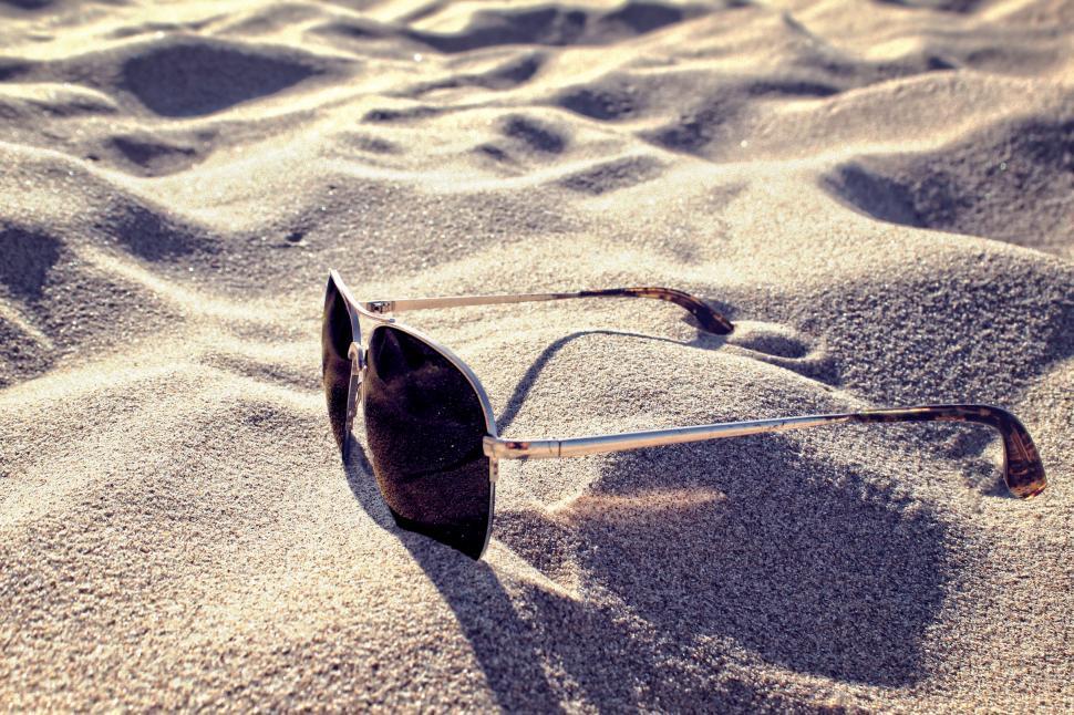 Free Image of Sunglasses on the Sand - Summer Concept 