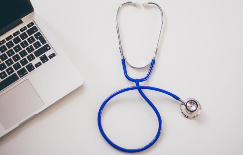 Free Image of Stethoscope Next to Laptop Computer 