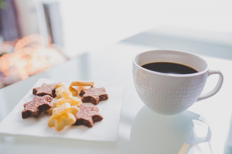 Free Image of A Cup of Coffee and Cookies on a Table 