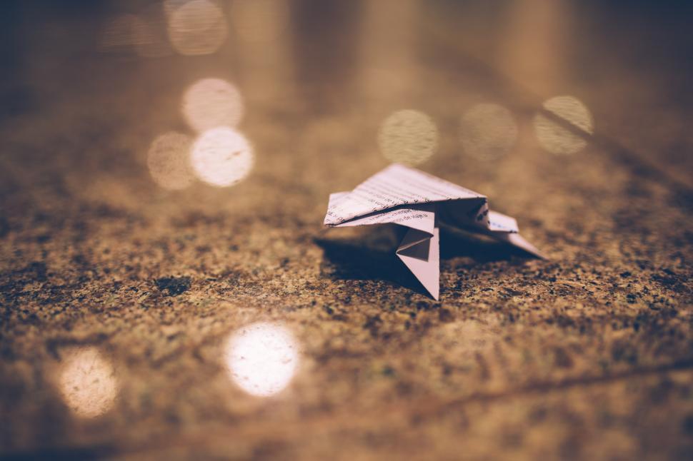 Free Image of Paper Airplane on Table 