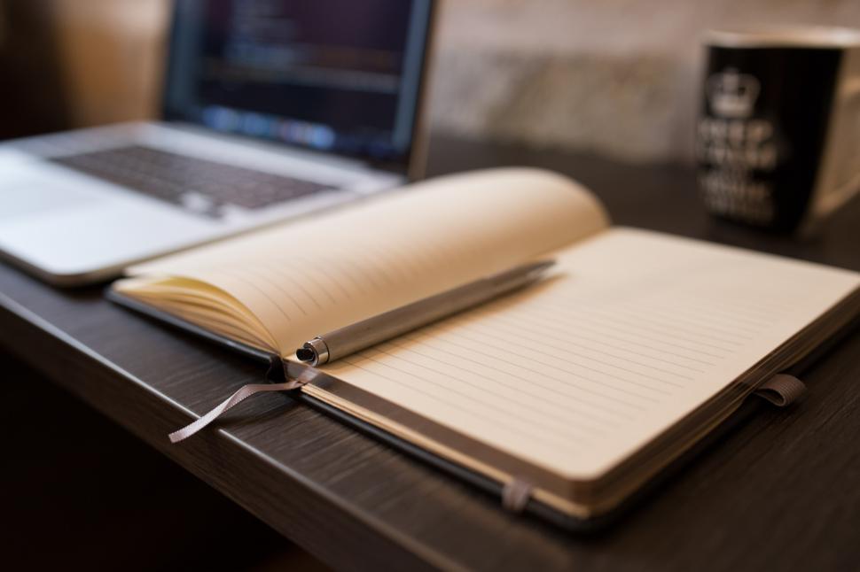 Free Image of Open Notebook and Laptop on Desk 