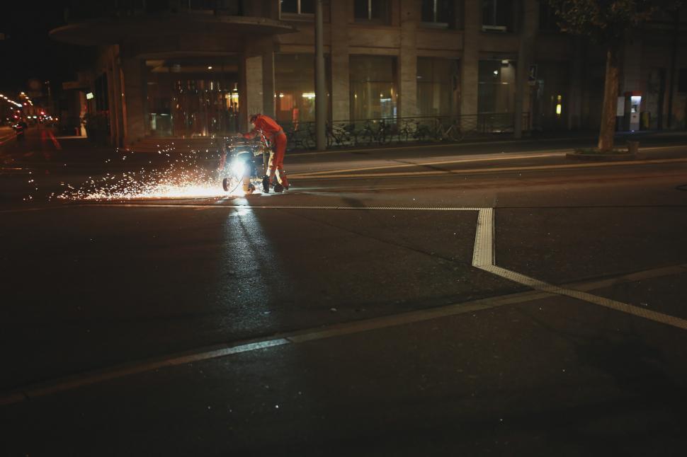 Free Image of Fire Hydrant Spraying Water on Street at Night 