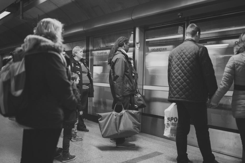 Free Image of People Waiting for a Train at a Station 