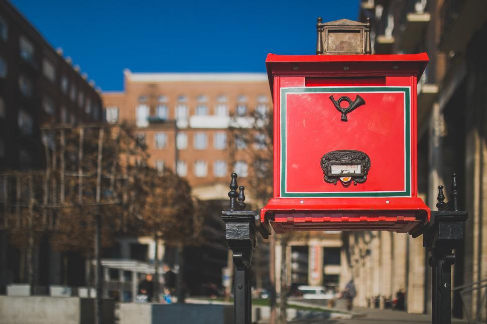 Free Image of Red Box Mounted on City Street Pole 