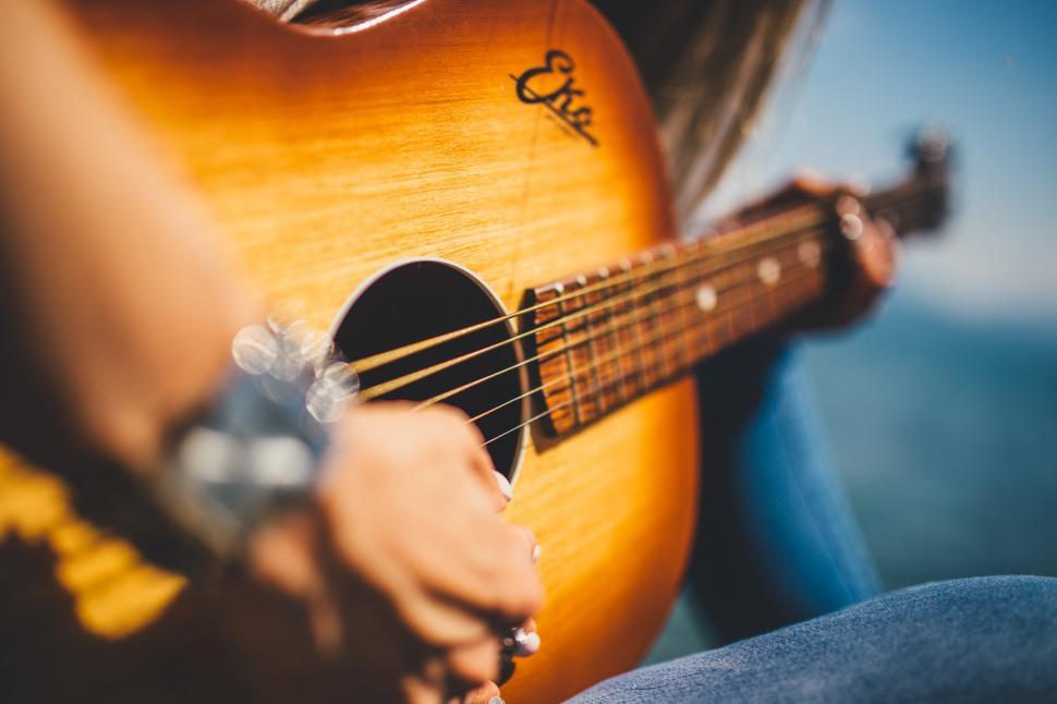 Free Image of Close-Up of Person Playing Guitar 