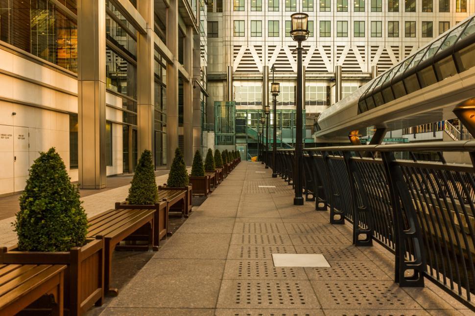 Free Image of Row of Benches on Sidewalk 