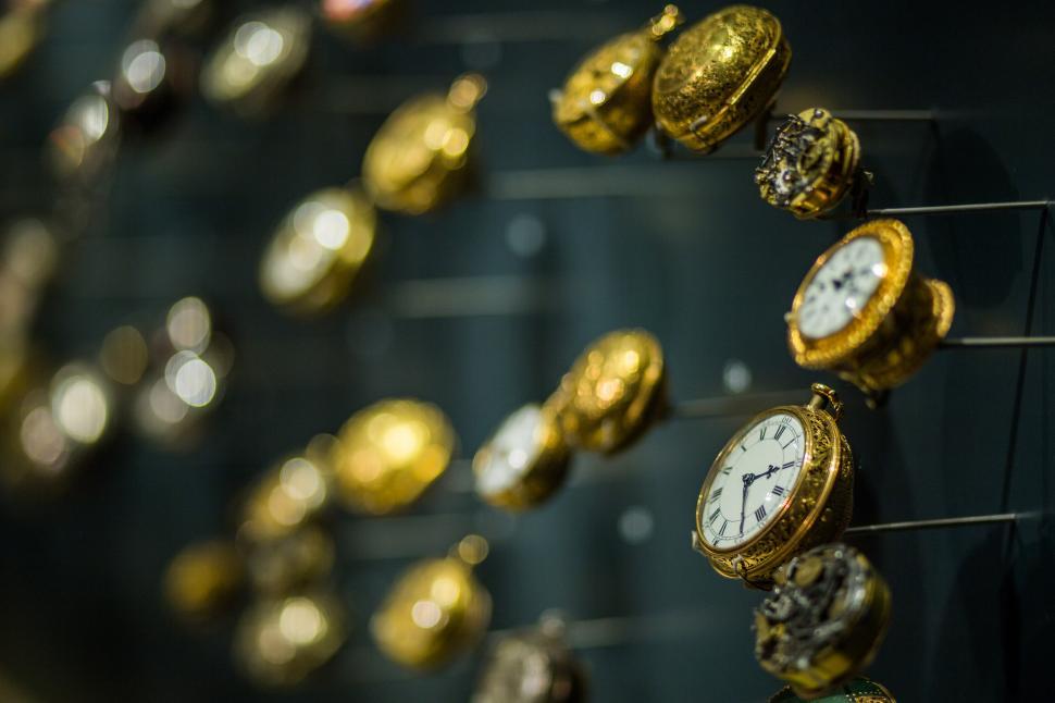 Free Image of Array of Clocks Adorning a Wall 