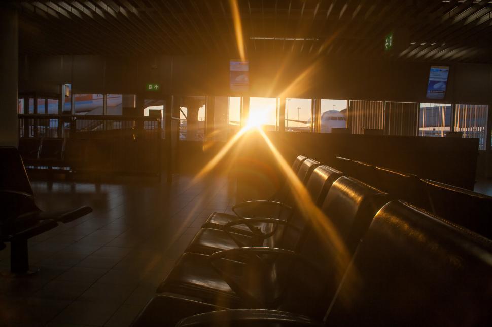 Free Image of Bright Sunlight Shining Through Airport Windows 