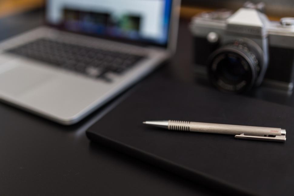 Free Image of Laptop Computer, Pen, and Camera on Table 