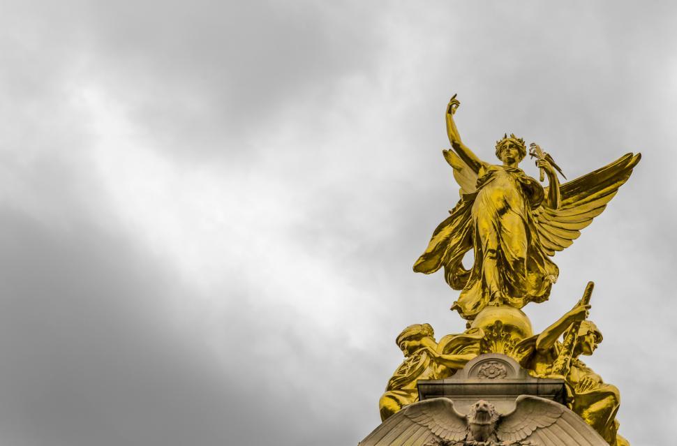 Free Image of Golden Statue Adorning Roof of Building 