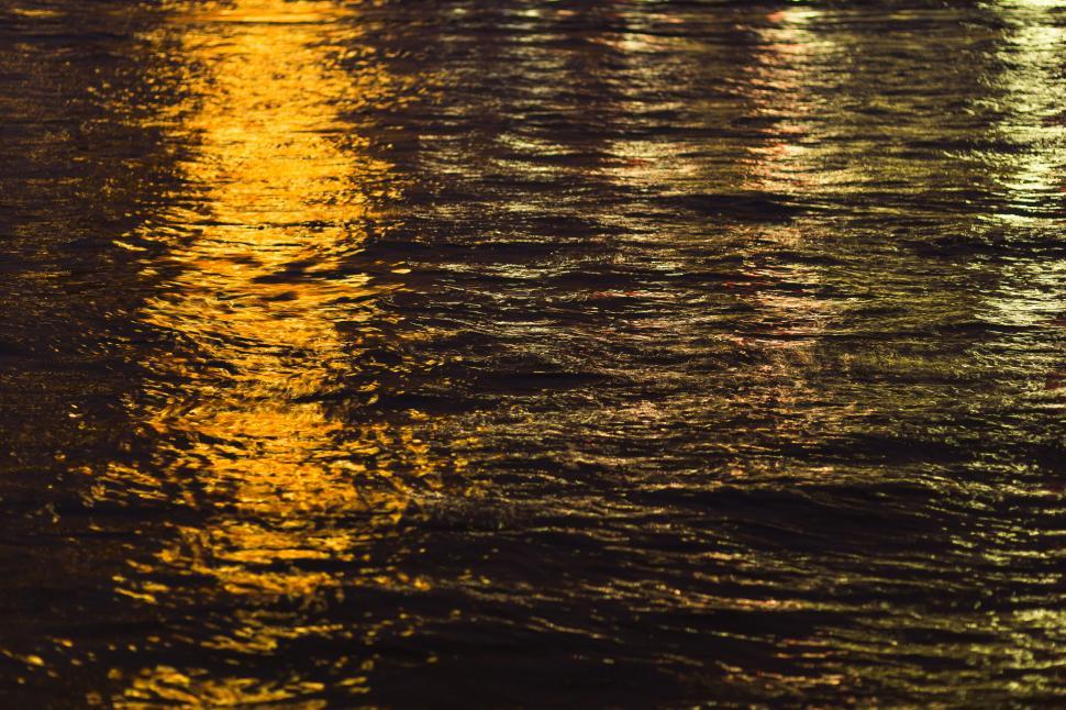 Free Image of Lights of a Boat Reflecting in Water 