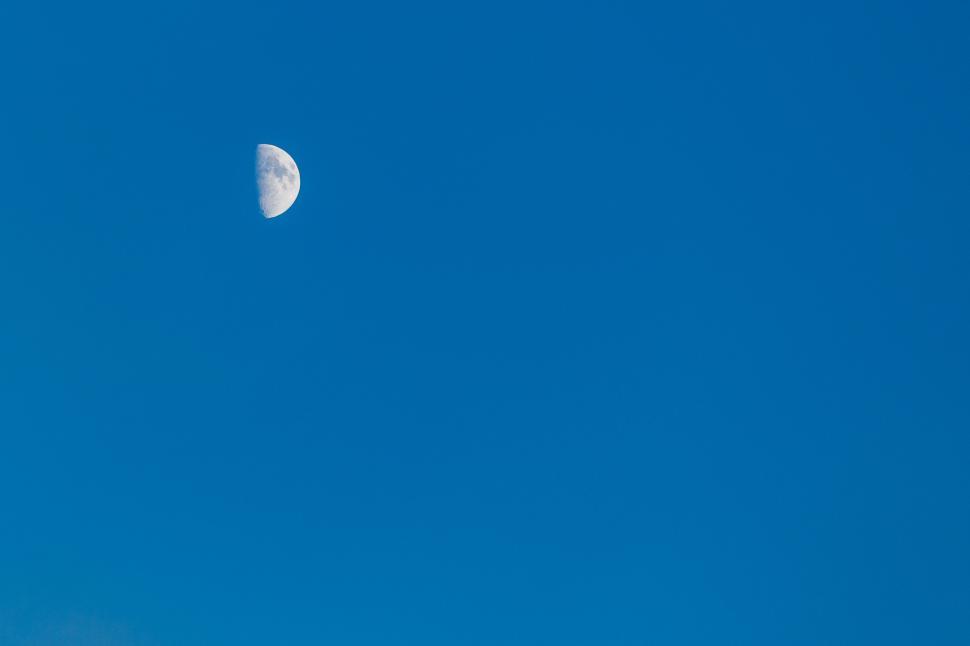 Free Image of Plane Flying in the Sky With a Half Moon 