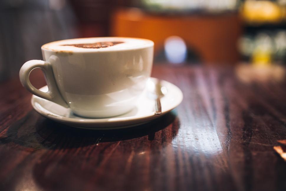 Free Image of A Cup of Coffee on a Wooden Table 