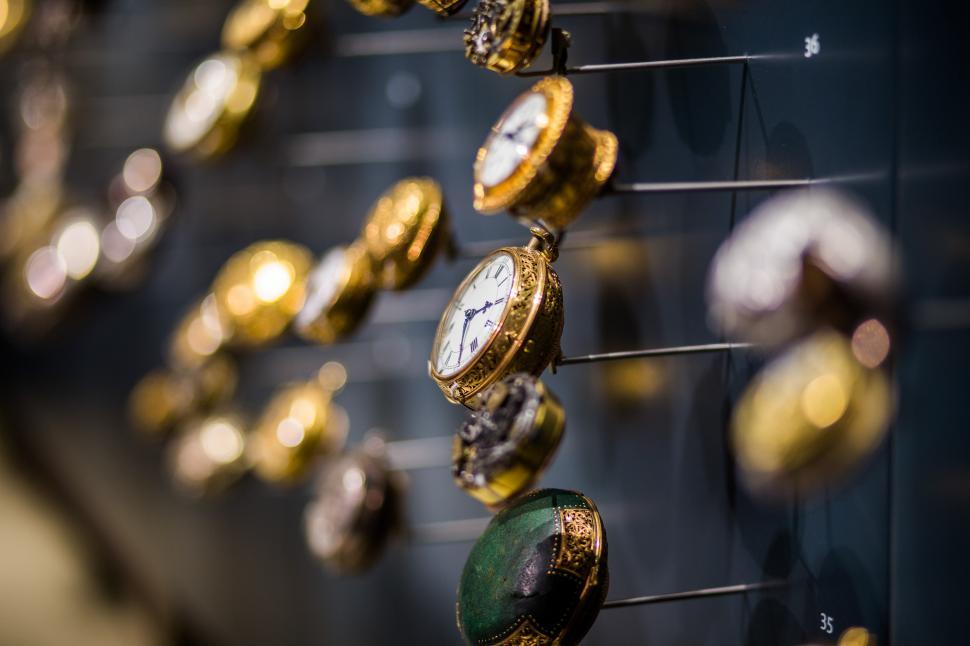 Free Image of Array of Clocks Mounted on a Wall 