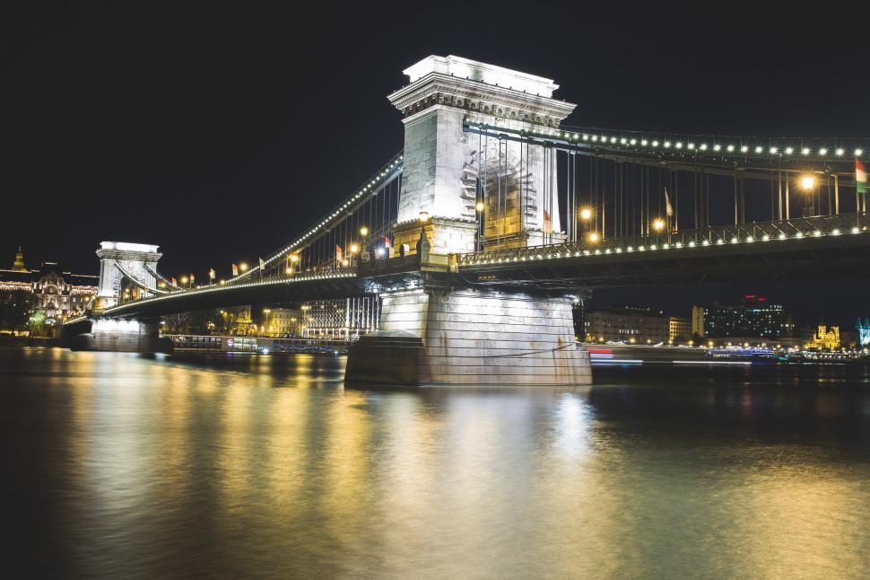 Free Image of Large Bridge Illuminated Over Water at Night 