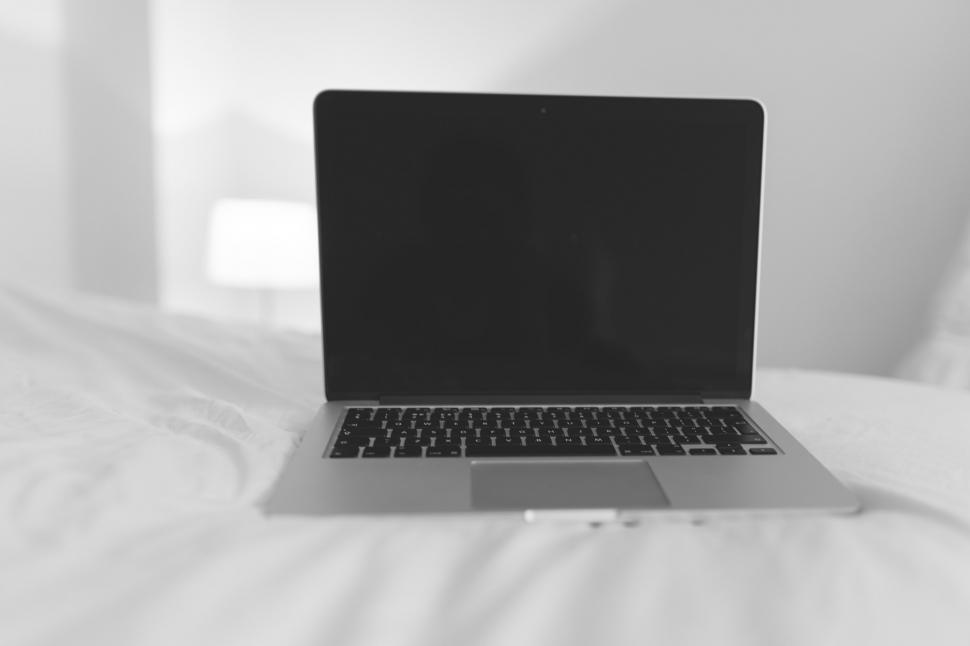 Free Image of Laptop on Bed 