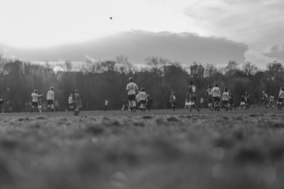 Free Image of Group of People Playing Soccer on a Field 