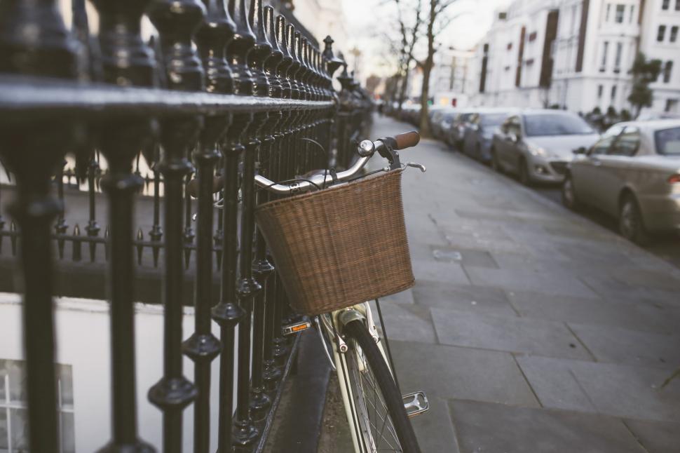 Free Image of Bicycle Parked Next to Fence on Street 