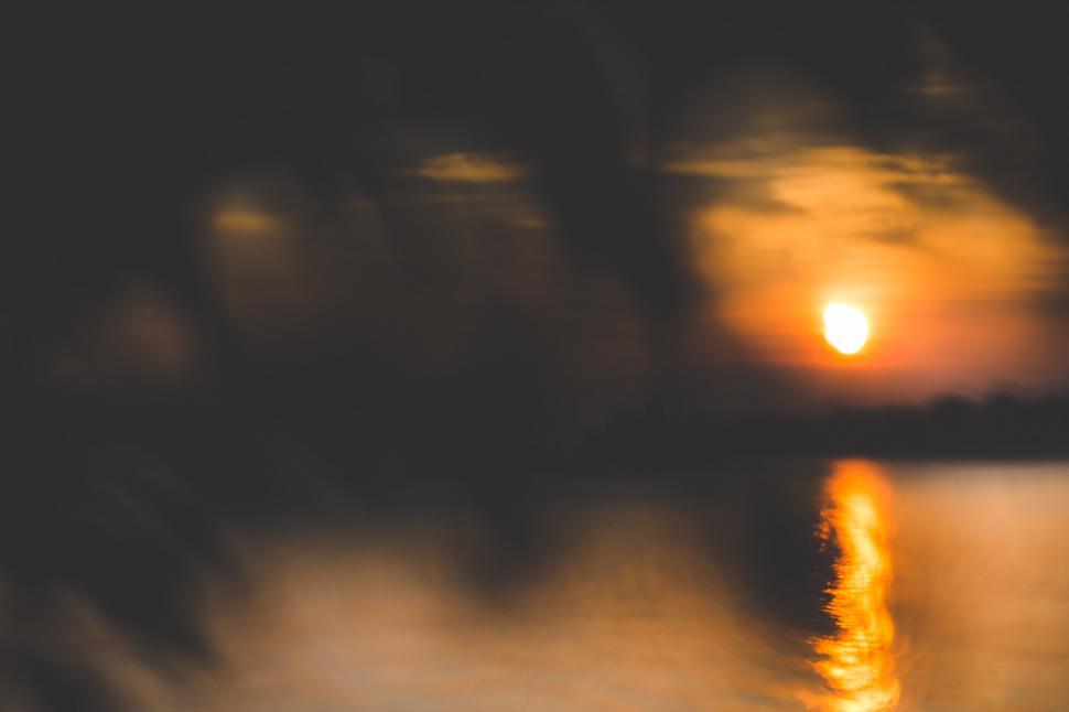 Free Image of Blurry Sunset Over Water 