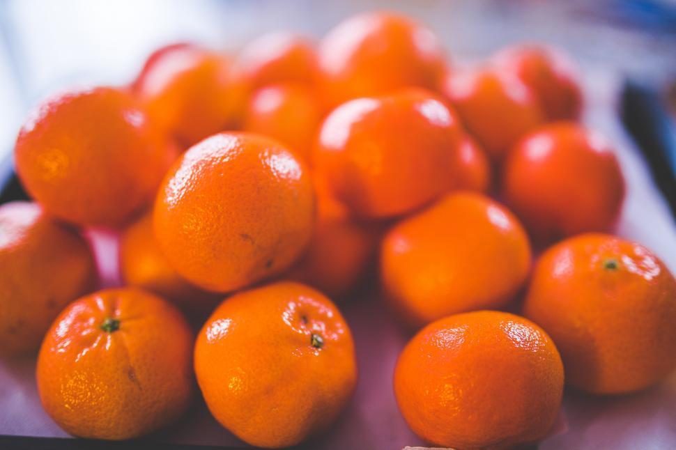 Free Image of A Pile of Oranges on a Table 