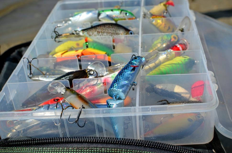 Free Image of Box with lures lies on the fishing bag  