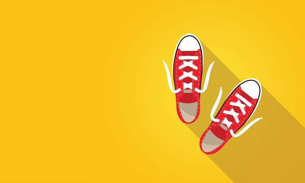 Free Image of Red Sneakers on Bright Yellow Background - With Copyspace 