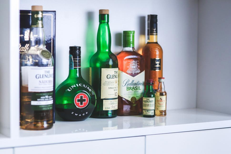 Free Image of Shelf Filled With Bottles of Liquor 