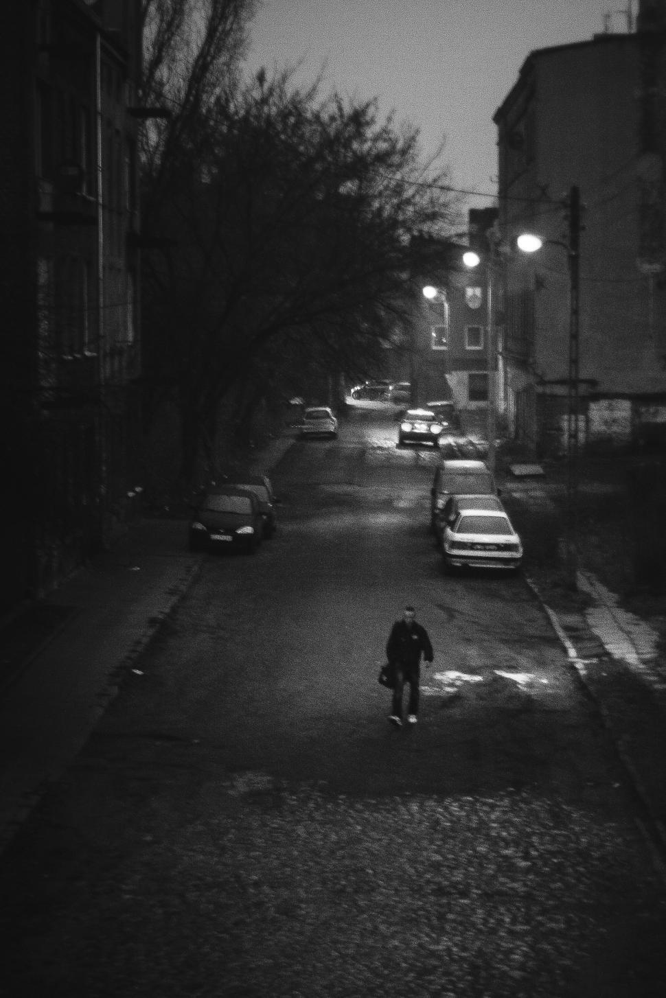 Free Image of Person Walking Down a Night Street 