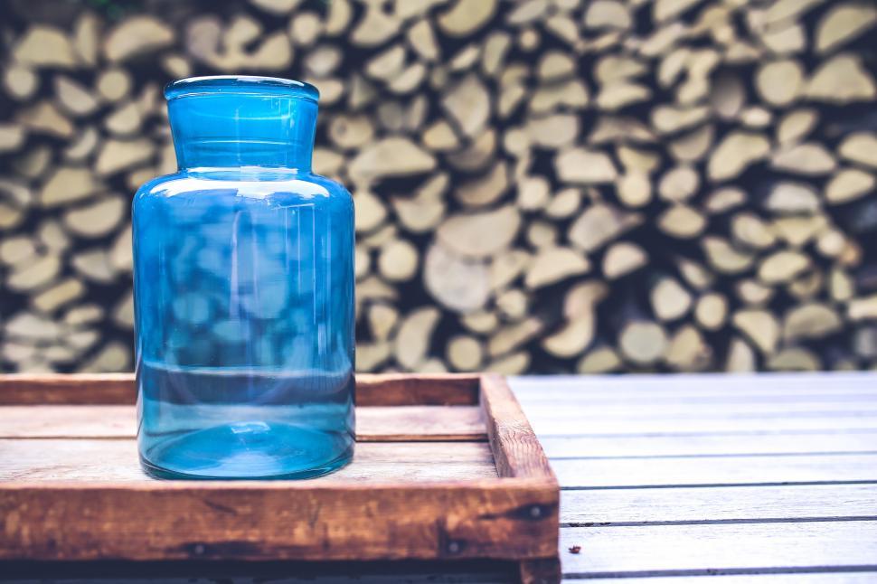 Free Image of Blue Glass Bottle on Wooden Tray 