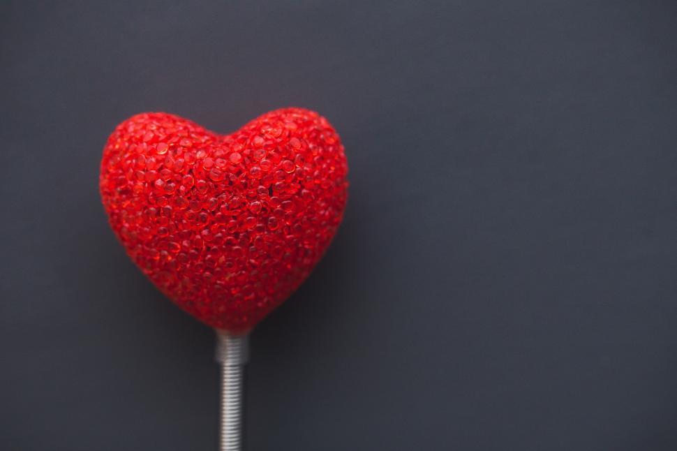 Free Image of Red Heart Shaped Lollipop on a Stick 
