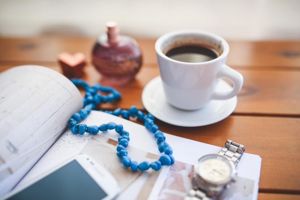 Free Image of A Book, Watch, and Cup of Coffee on a Table 