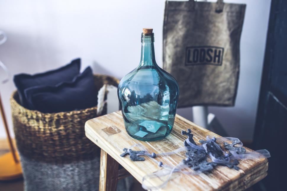 Free Image of Blue Glass Bottle on Wooden Table 