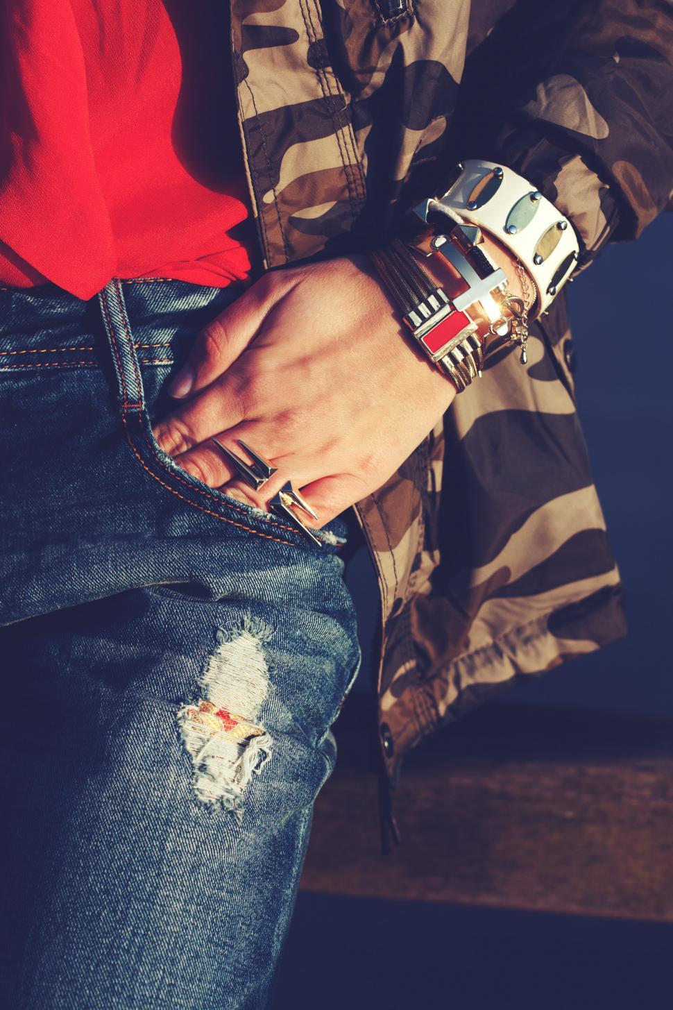 Free Image of Person Wearing Red Shirt and Ripped Jeans 