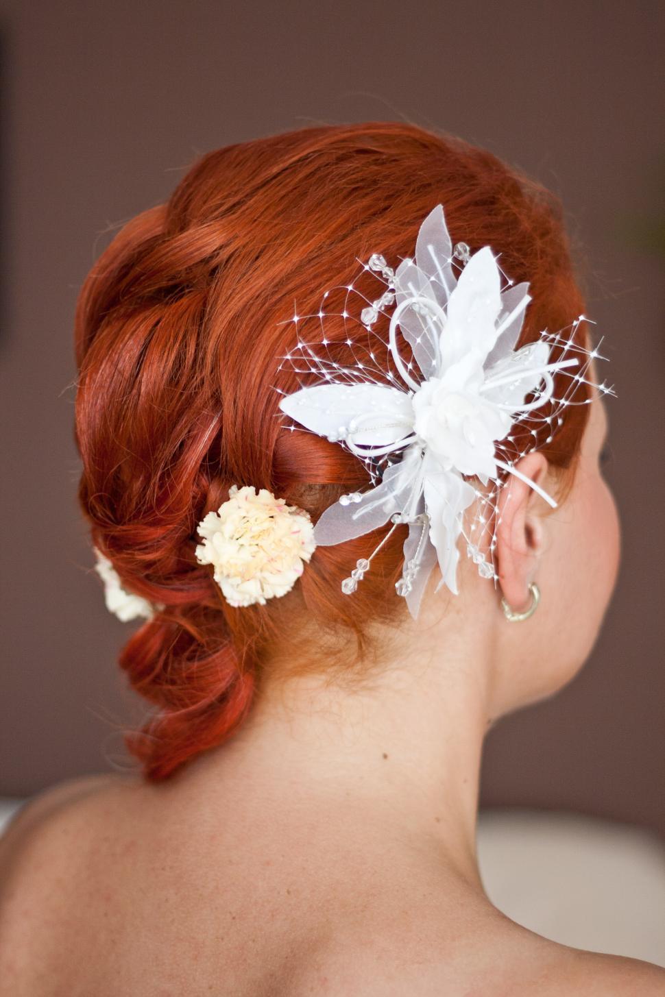 Free Image of Woman With Red Hair and Flower in Hair 