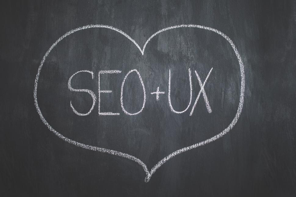 Free Image of Chalk Drawing of Heart With SEO - UX Written on It 